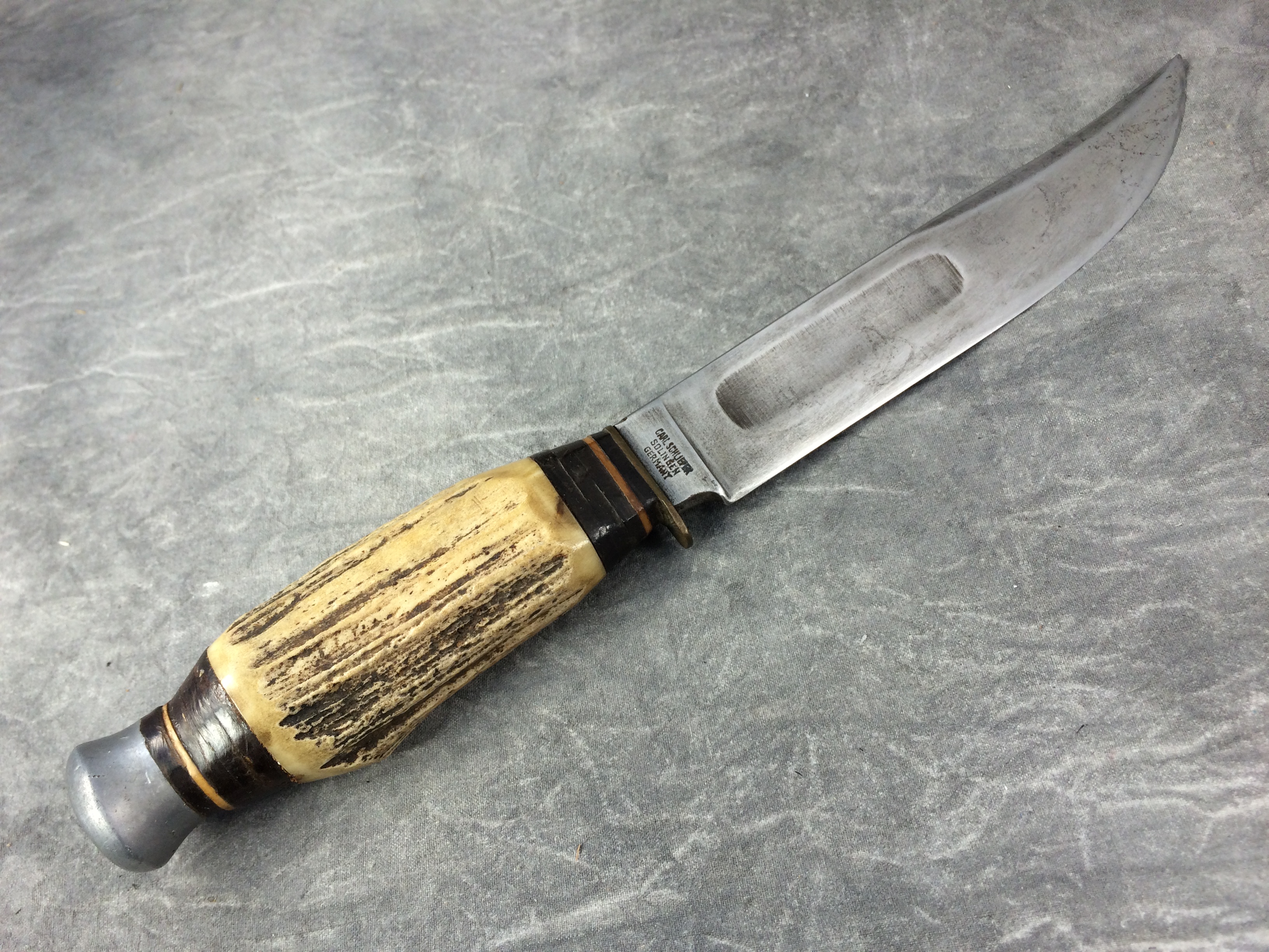 What is a Vintage CARL SCHLIEPER Eye Brand Jim Bowie Stag Stacked Leather  Knife With Sheath worth?