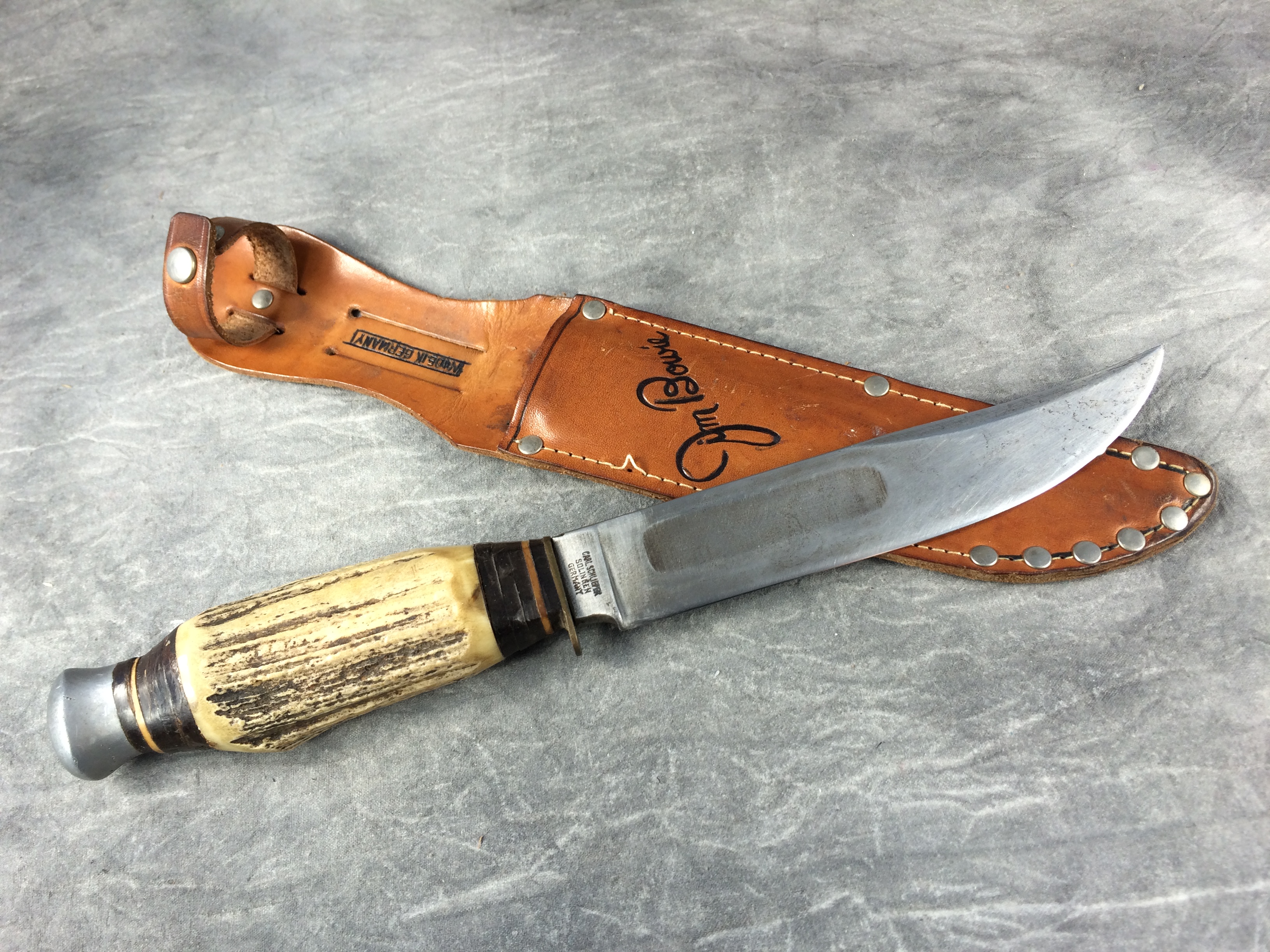 What is a Vintage CARL SCHLIEPER Eye Brand Jim Bowie Stag Stacked Leather  Knife With Sheath worth?